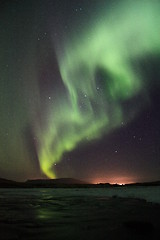 Image showing Aurora borealis over the frozen river in Iceland