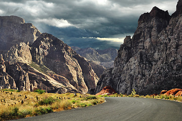 Image showing road to mountains and dramatic sky 