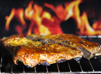 Image showing pork ribs on a grill