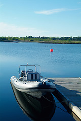 Image showing Rigid inflatable boat at a pier