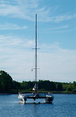 Image showing Catamaran sailboat at anchor