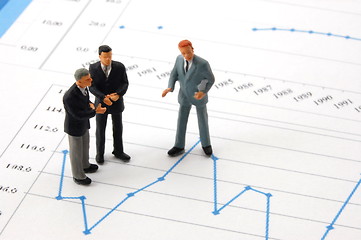 Image showing business man over economic chart