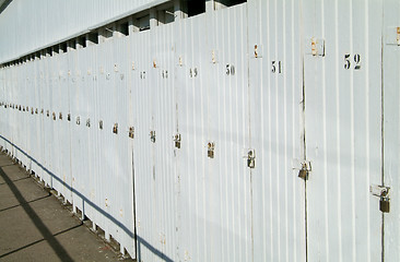 Image showing Row of doors with padlocks