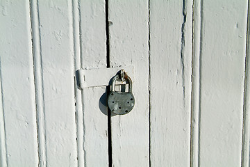 Image showing Detail of old door with padlock