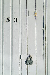 Image showing Detail of wooden door with padlock