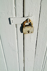 Image showing Detail of old, wooden door with padlock