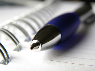 Image showing Blue pencil on spiral note book