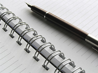 Image showing White diary and pen