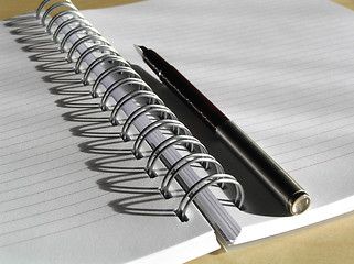 Image showing Spiral diary and pencil