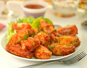 Image showing hot chicken wings with salad