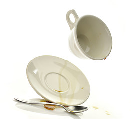 Image showing Cup and saucer with spilled coffee