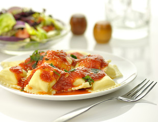 Image showing Ravioli pasta with red tomato sauce