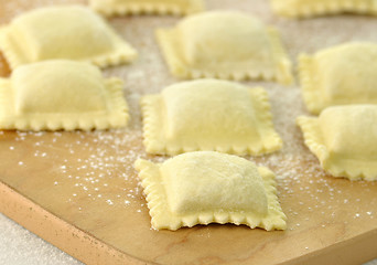 Image showing Uncooked Ravioli on a cutting board