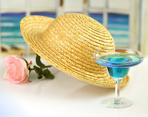 Image showing straw hat and cocktail