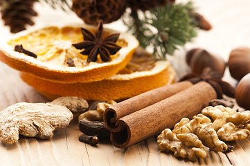 Image showing Different kinds of spices, nuts and dried oranges - christmas de