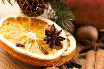 Image showing Different kinds of spices, nuts and dried oranges - christmas de