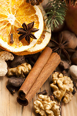 Image showing Different kinds of spices, nuts and dried oranges - christmas de