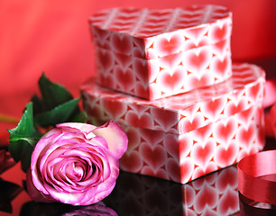 Image showing pink rose and gift boxes