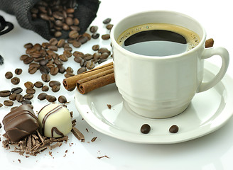 Image showing cup of coffee and chocolate candies 