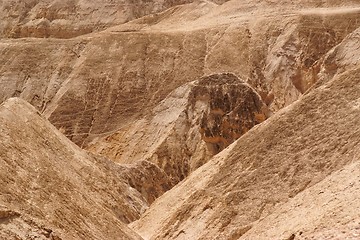 Image showing Textured orange hills in the desert 