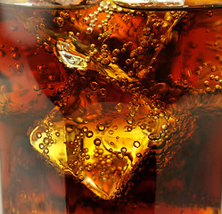 Image showing cola with ice cubes close up 