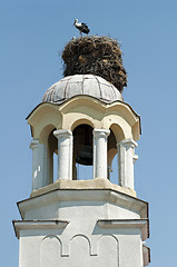 Image showing Stork in nest on dome of a church