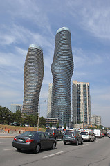 Image showing Tow round high rise buildings.