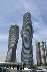 Image showing Tow round high rise buildings.