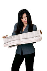 Image showing Woman with open newspaper reading.