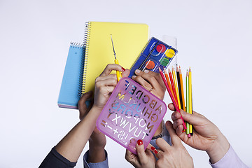 Image showing Hands holding education objects