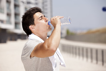 Image showing Athlete drinking water