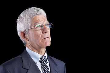 Image showing Senior businessman looking up