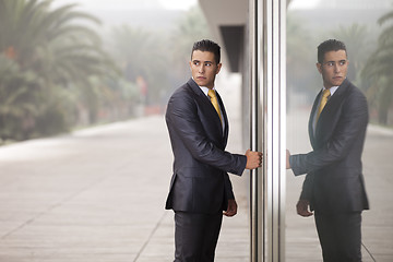 Image showing Businessman open the office door