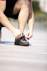 Image showing Tightening the shoelace