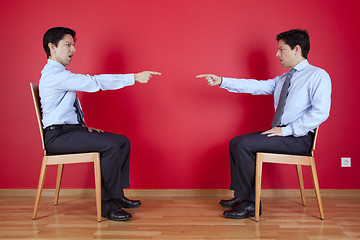 Image showing Twin businessman fighting