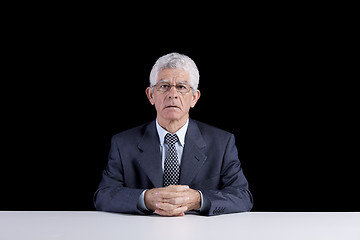 Image showing Senior man at the desk