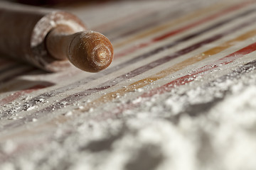 Image showing Rolling pin and flour