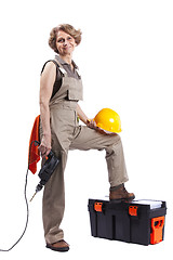 Image showing Senior woman with a drill tool