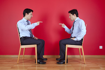 Image showing Twin businessman fighting