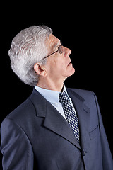 Image showing Senior businessman looking up