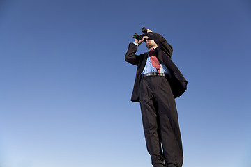 Image showing Businessman searching with his binoculars