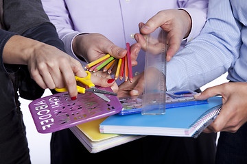 Image showing Hands holding education objects