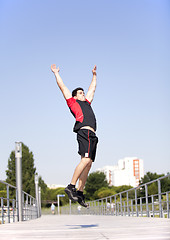 Image showing Athlete jumping at the park