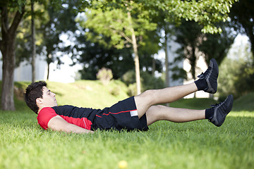 Image showing Athlete man making abdominals