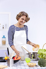 Image showing Senior woman cooking