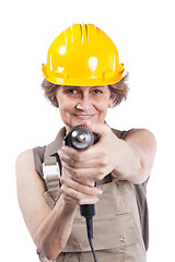 Image showing Senior woman with a drill tool