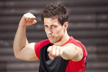 Image showing Athlete showing his muscles