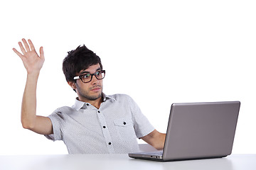 Image showing Young man with fear of his laptop