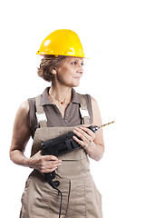 Image showing Senior woman with a drill tool