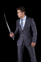 Image showing Businessman holding a ninja sword